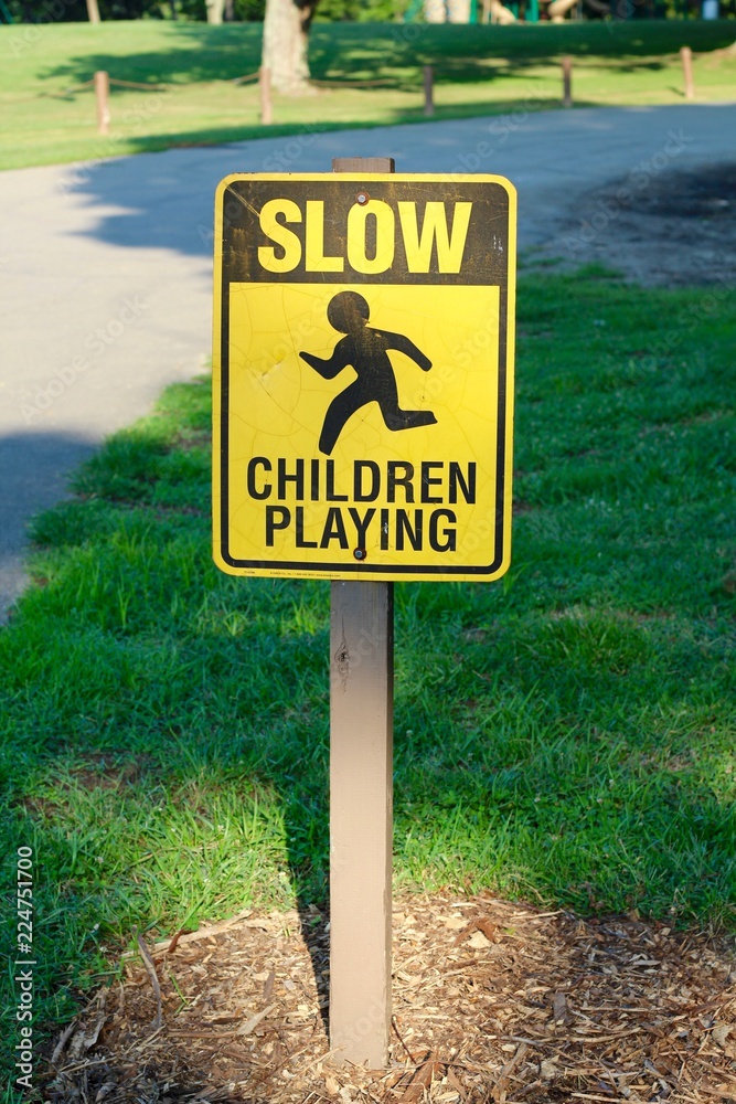A children playing caution sign on a closeup view. A children playing caution sign on a closeup view.