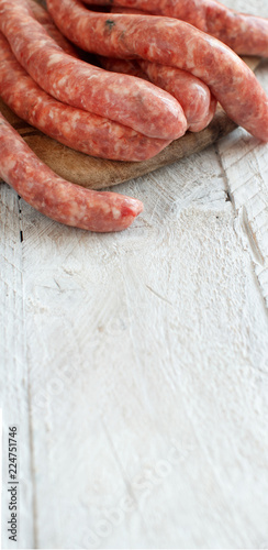 Raw Sausages on a wooden board