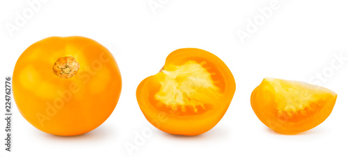 Set of yellow tomatoes whole, half and slice on a white, isolated.