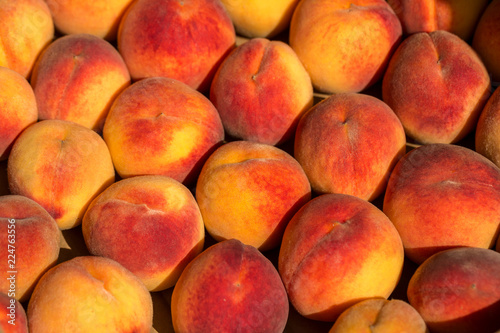 beautiful big red peaches in a drawer