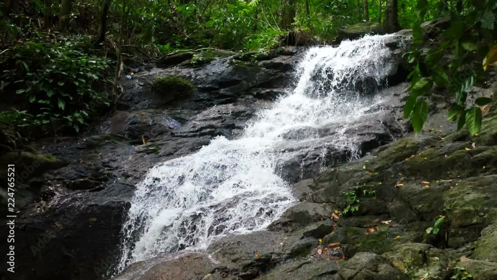 clear cold waterfall flow into rock clear cold waterfall flow into rock