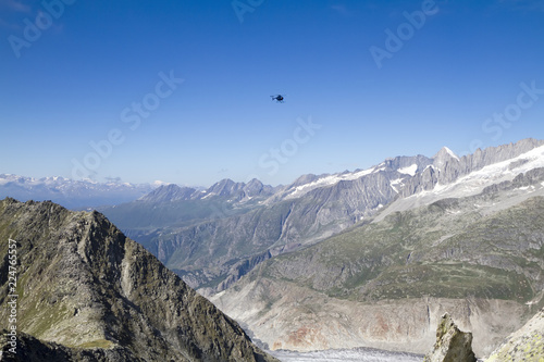 Mountain panorama of the Jungfrau-Aletch district, Wallis, Switzerland, the helicopter flies