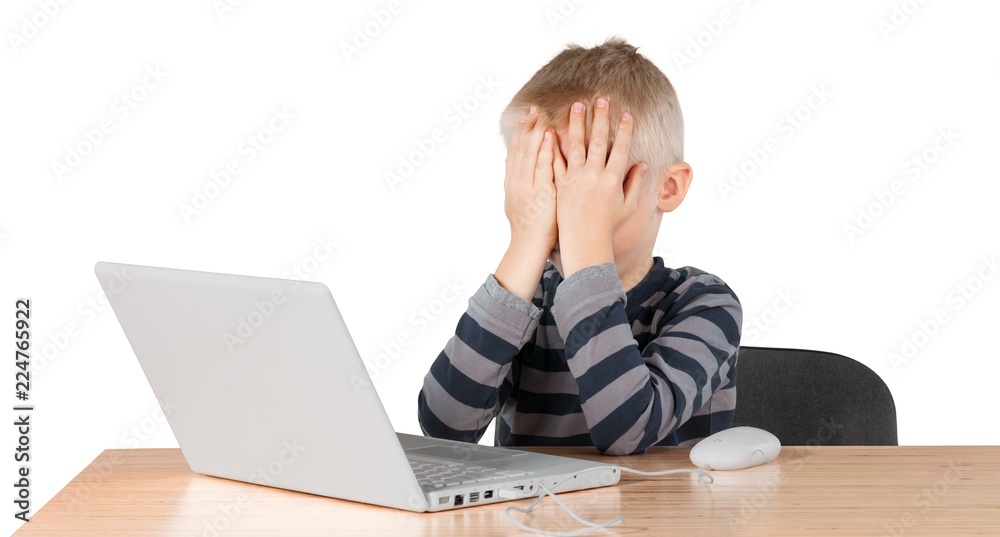 Child boy male laptop desk mouse frustrated Child boy male laptop desk mouse frustrated