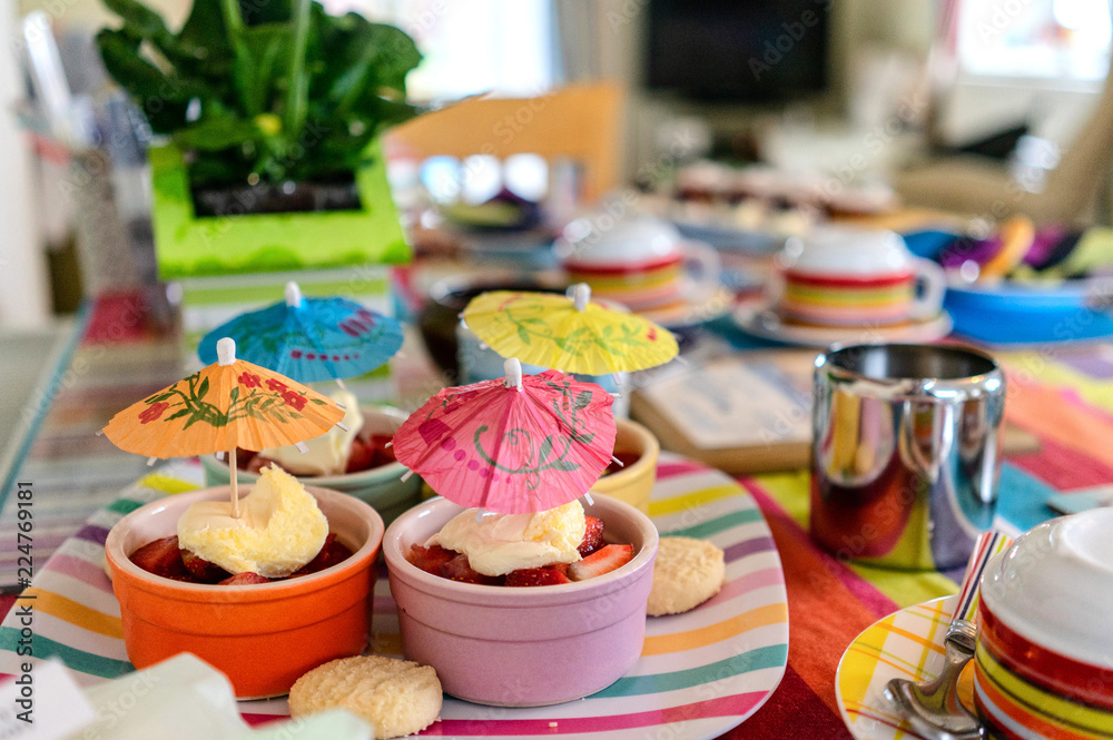 home made cakes on a table with cocktail umbrellas