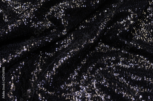 Synthetic fabric black with sequins photo