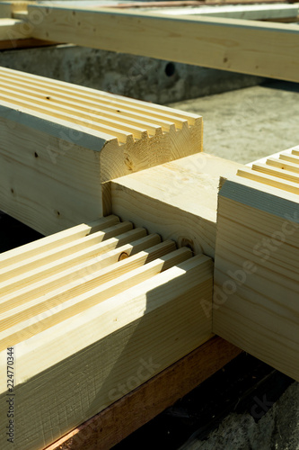 Construction of a wooden house made of profiled laminated veneer lumber. Bookmark corners.