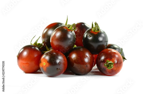 Black tomato isolated on white. photo