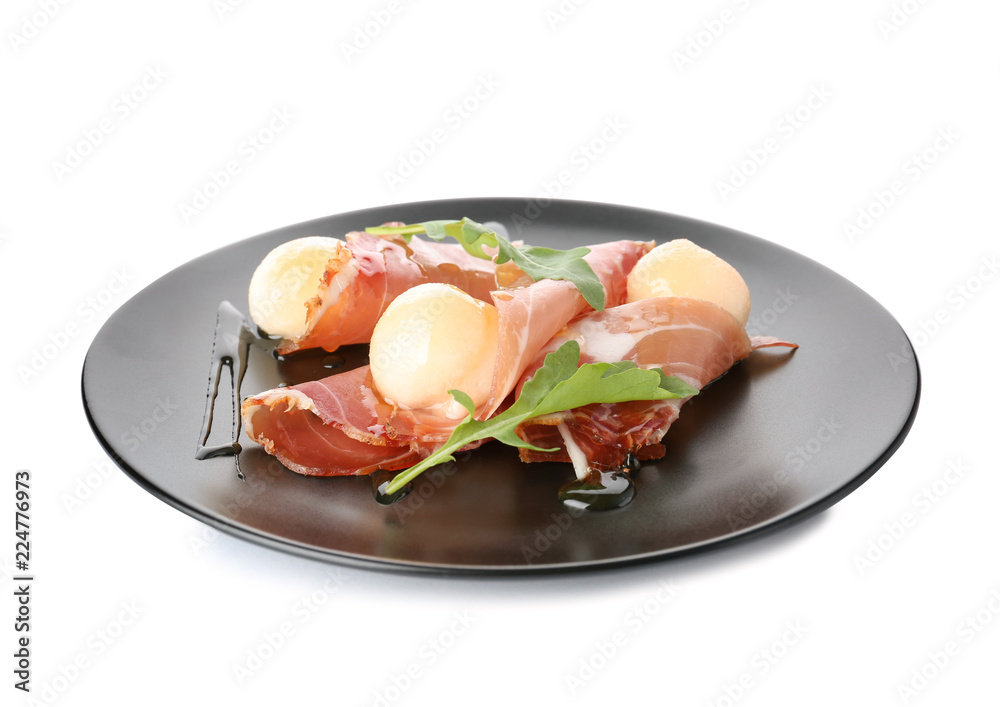 Plate with melon balls and prosciutto on white background Plate with melon balls and prosciutto on white background