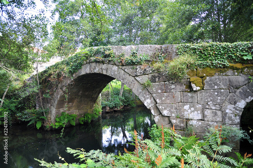 PACOS, CAMINO DE SANTIAGO, SPAIN - JULY 11, 2018: Camino Portuguese, Pacos, Roman bridge