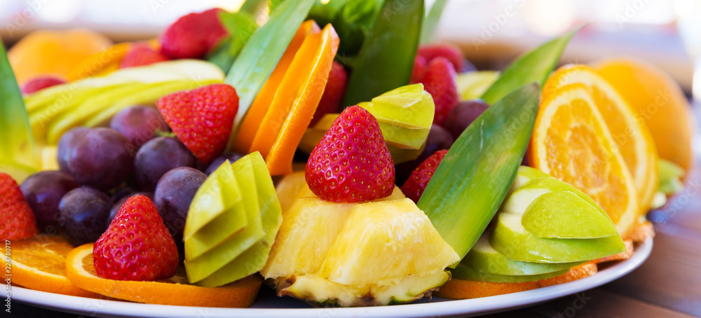 Party plate with fresh fruit cuts on table Party plate with fresh fruit cuts on table