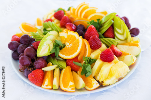 Party plate with fresh fruit cuts on table