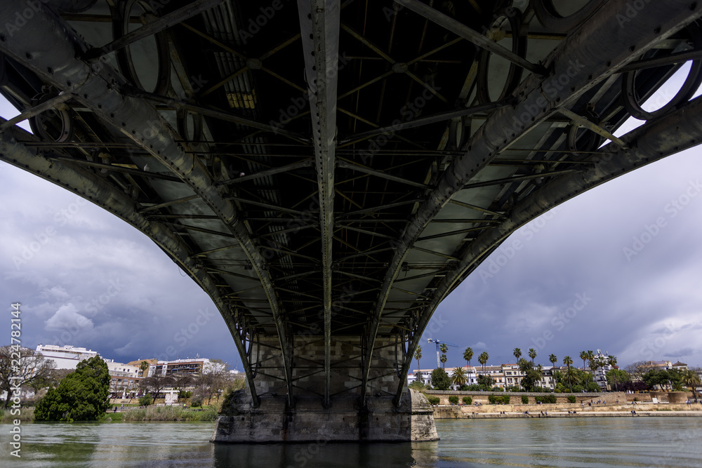 abstract with a bridge over the guadalquivir river in Seville, Andalucia. Spain