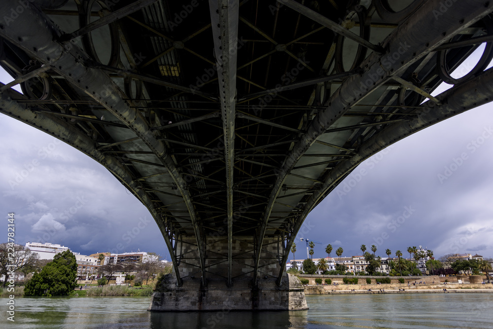 abstract with a bridge over the guadalquivir river in Seville, Andalucia. Spain abstract with a bridge over the guadalquivir river in Seville, Andalucia. Spain