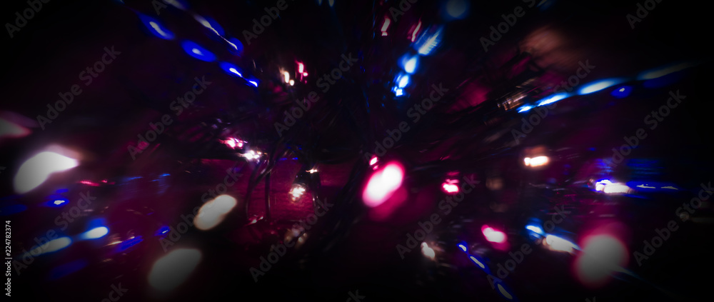 Neon sparks on a dark background. Neon light, laser. Blurred background. Abstract dark festive background. Neon sparks on a dark background. Neon light, laser. Blurred background. Abstract dark festive background.
