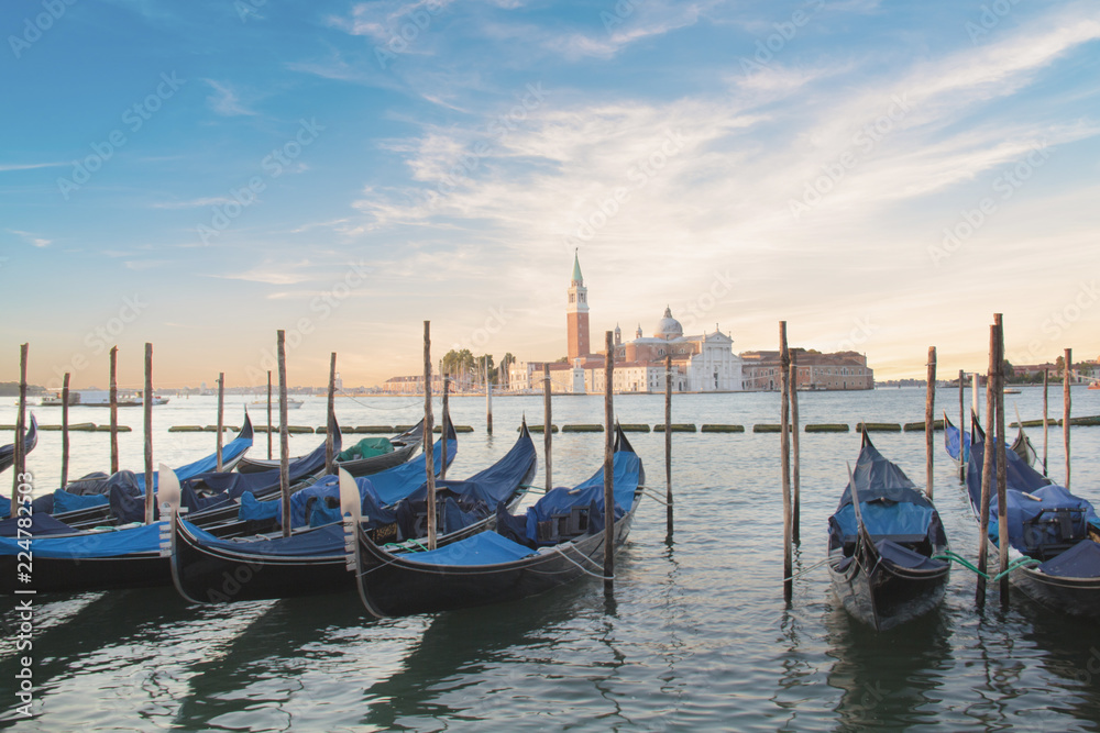 Beautiful view of the gondolas and the Cathedral of San Giorgio Maggiore, on an island in the Venetian lagoon, Venice, Italy