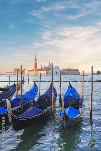 Beautiful view of the gondolas and the Cathedral of San Giorgio Maggiore, on an island in the Venetian lagoon, Venice, Italy © marinadatsenko