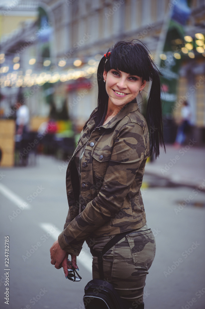 happy brunette woman outdoors in the city happy brunette woman outdoors in the city