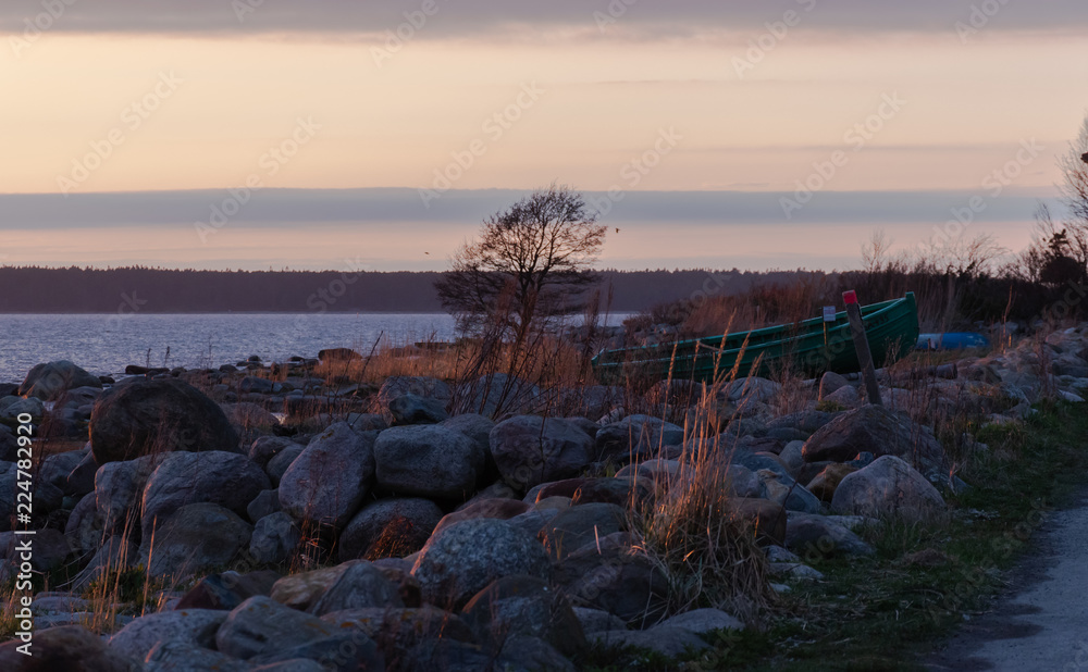 Morning landscape. Beautiful morning on the coast. An old wooden boat stands on the shore. Tallinn, Estonia Morning landscape. Beautiful morning on the coast. An old wooden boat stands on the shore. Tallinn, Estonia