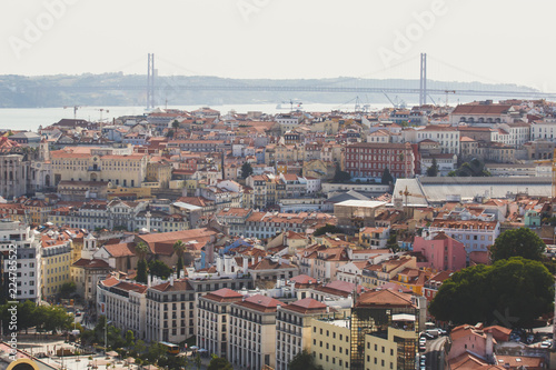 Beautiful super wide-angle aerial view of Lisbon, Portugal with harbor and skyline scenery beyond the city, shot from belvedere observation deck
