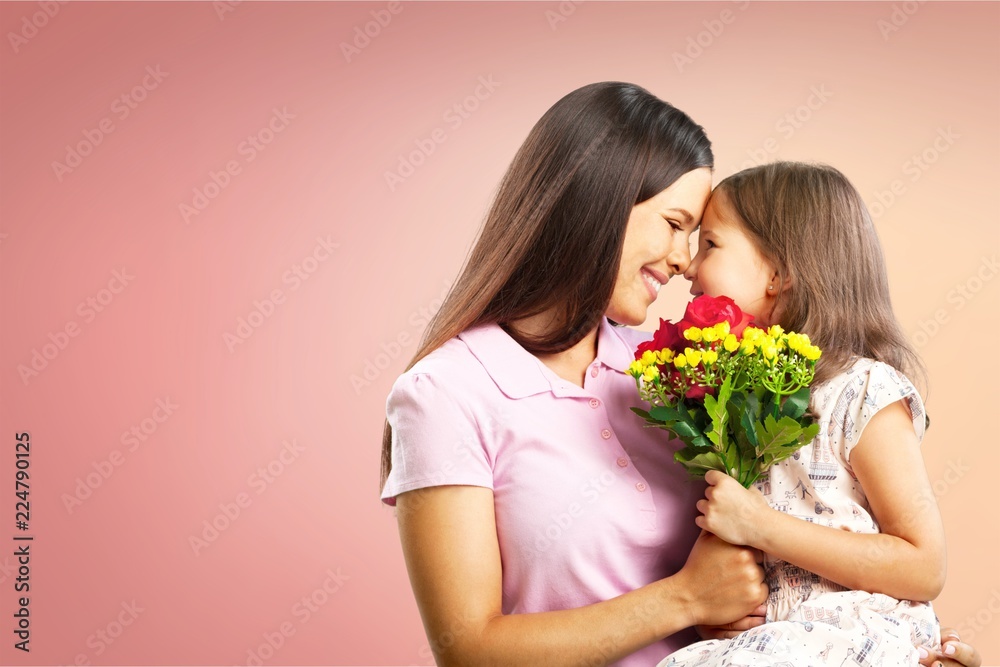 Happy Mother and daughter together with flowers Happy Mother and daughter together with flowers