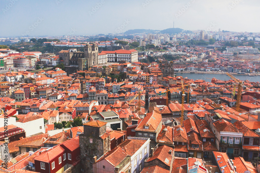Beautiful super wide-angle summer aerial view of Porto, Norte Portugal region, Portugal, with skyline and scenery beyond the old town, shot from the observation deck of Clerigos church tower