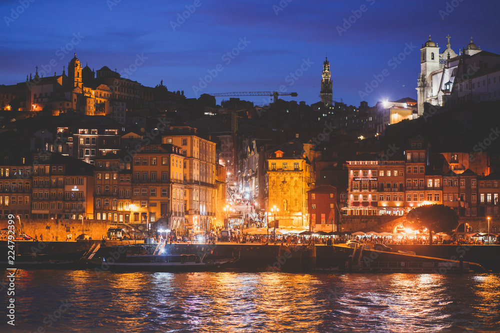 Beautiful super wide-angle panoramic summer aerial view of Old Porto Oporto city and Ribeira Square with the old town, during the sunset over Douro river from Vila Nova de Gaia, Porto, Portugal