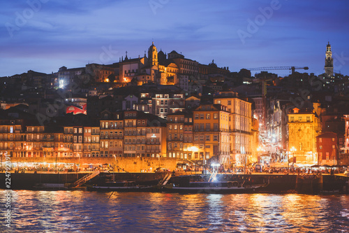 Beautiful super wide-angle panoramic summer aerial view of Old Porto Oporto city and Ribeira Square with the old town, during the sunset over Douro river from Vila Nova de Gaia, Porto, Portugal