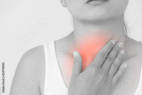 Sore Throat. Closeup Of Beautiful Young Woman Hand Touching Her Ill Neck. Healthcare and medical concept.