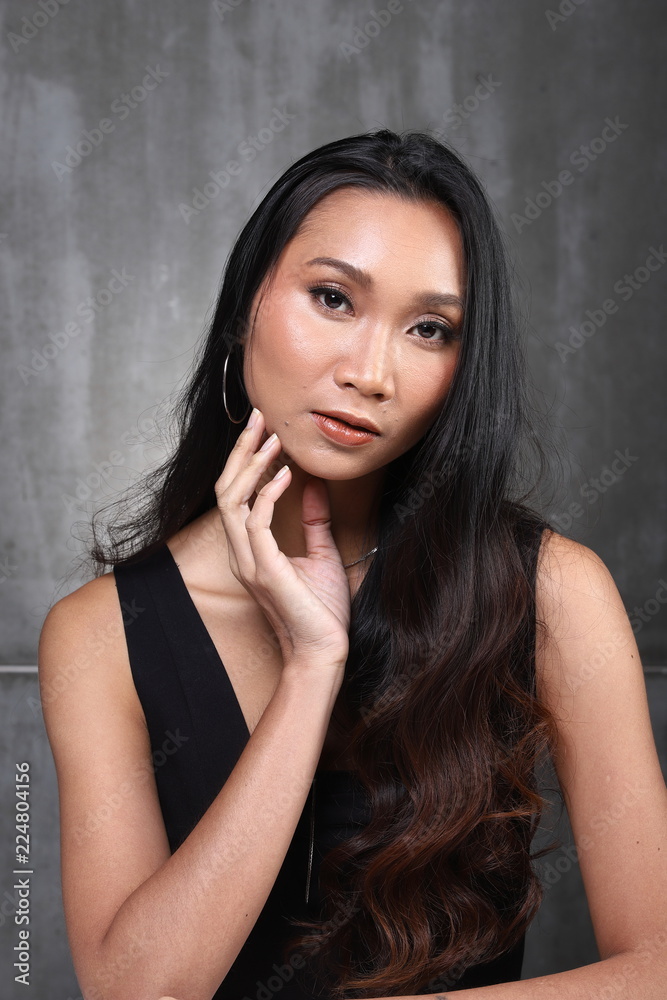 Asian Long straight black hair tan skin woman in Black dress Asian Long straight black hair tan skin woman in Black dress