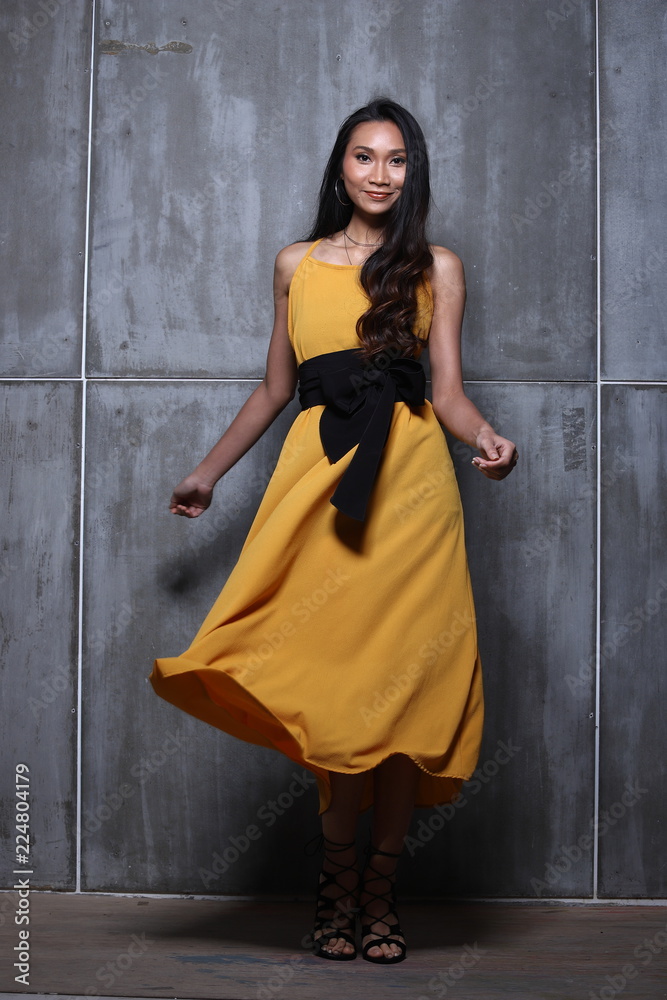 Asian Long straight black hair tan skin woman in Black dress Asian Long straight black hair tan skin woman in Black dress