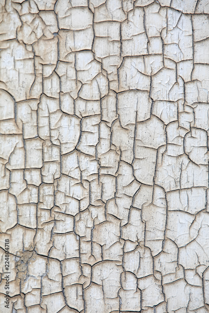 Decaying wall with cracked paint on it's surface Decaying wall with cracked paint on it's surface