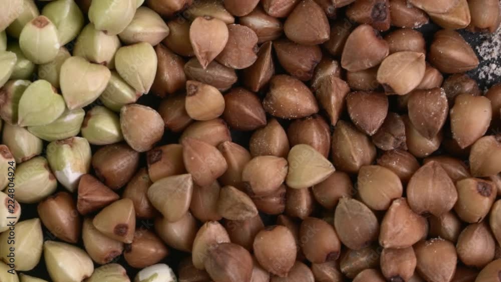 closeup of buckwheat groats, roasted kasha and flour - rotating background, low angle view closeup of buckwheat groats, roasted kasha and flour - rotating background, low angle view