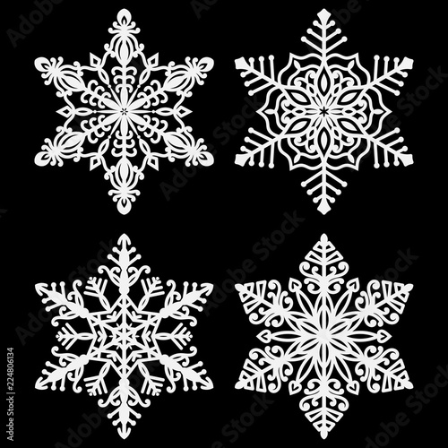 White Snowflakes - Set of 4 beautiful white snowflakes isolated on black background