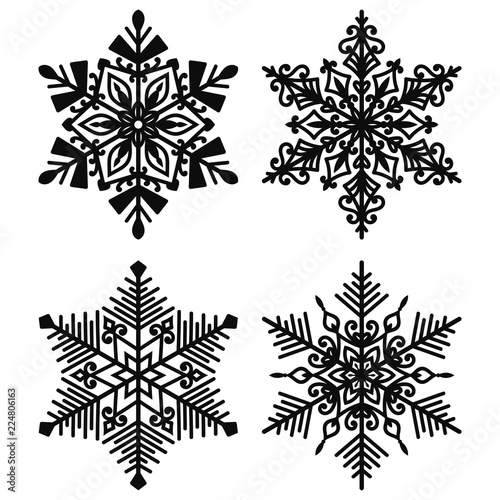 Black Snowflakes - Set of 4 beautiful black snowflakes isolated on white background