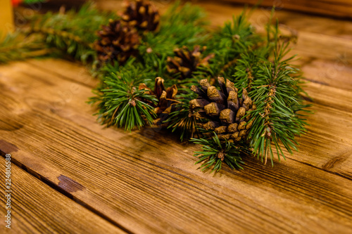 Fir tree branches on a wooden table