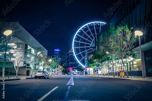 Big wheel in lights on dark street