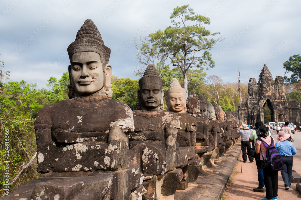 Fototapeta premium Angkor Wat, Cambodia 24 January 2018 : Tourists at Angkor Wat in Siem Reap. Angkor Wat is a 12th century temple and a world famous UNESCO World Heritage site.