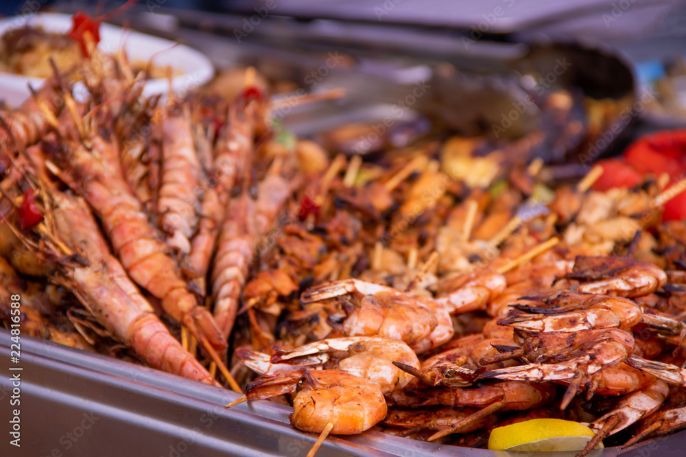 Delicious grilled seafood mussels and shrimp on market
