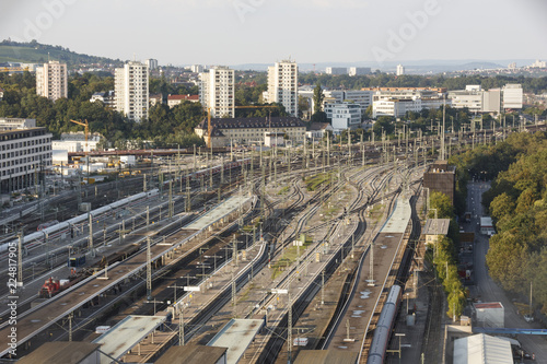 many railway lines at the main station in Stuttgart  Germany. Large railway center with houses in the background  top view