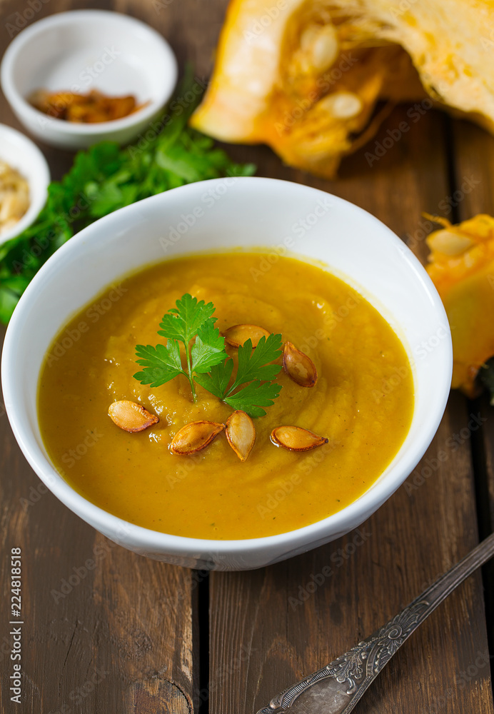pumpkin soup on wooden surface pumpkin soup on wooden surface