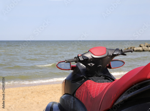 Red water scooter on the beach