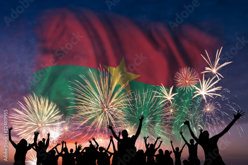 People are looking on fireworks and flag of Burkina Faso