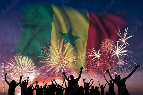 People are looking on fireworks and flag of Senegal
