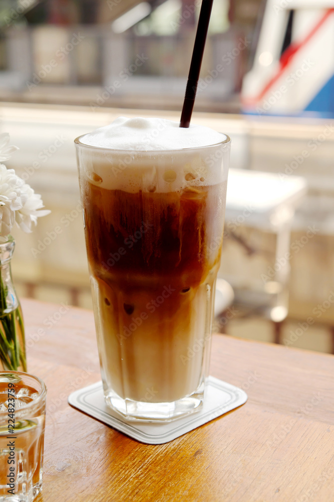 iced coffee on wooden table iced coffee on wooden table
