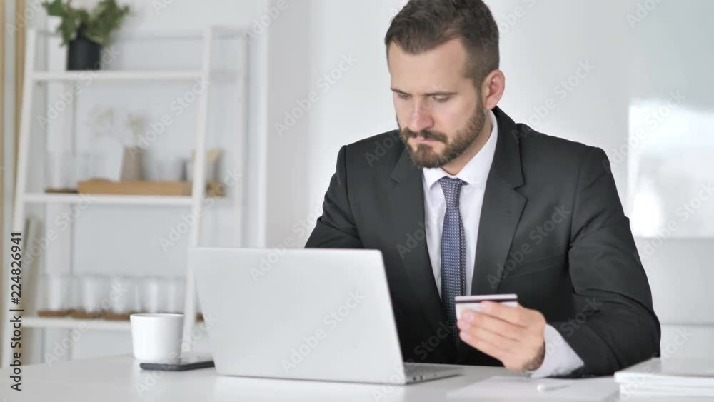 Online Payment with Debit Card by Businessman Online Payment with Debit Card by Businessman