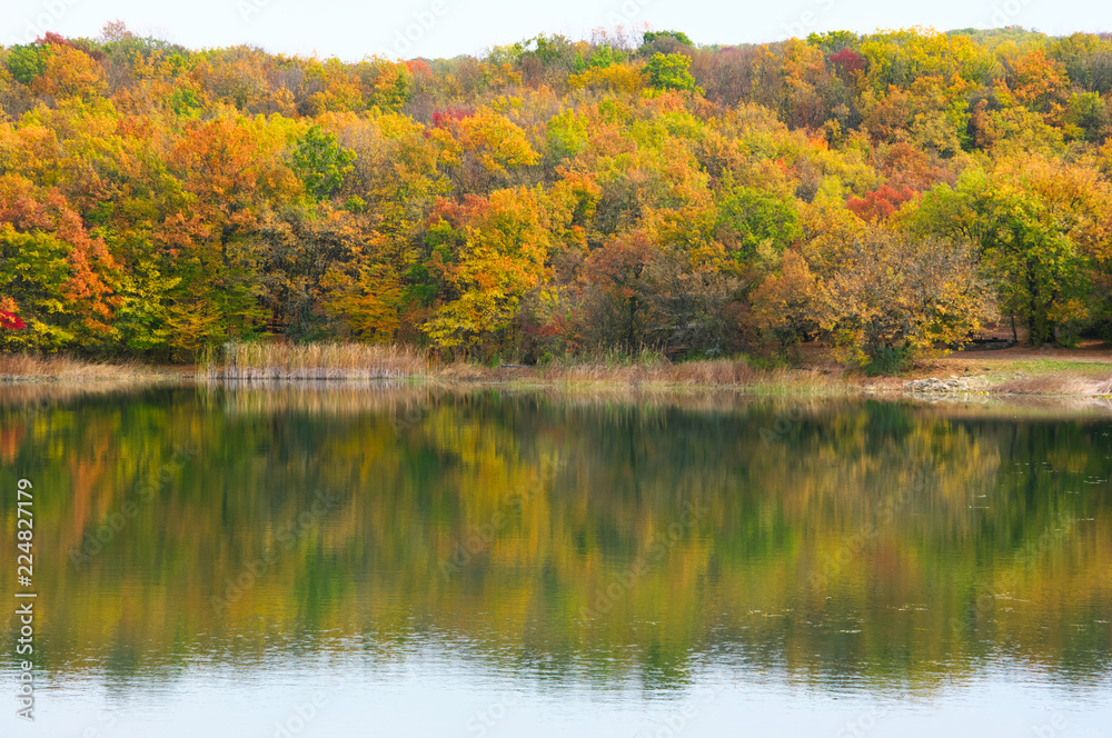Autumnal landscape with lake and hills Autumnal landscape with lake and hills