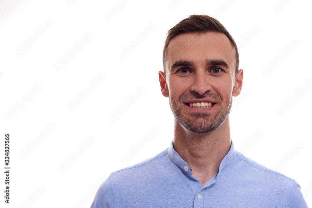 Casually handsome. Confident young handsome man in jeans shirt keeping arms crossed and smiling while standing against white background Casually handsome. Confident young handsome man in jeans shirt keeping arms crossed and smiling while standing against white background