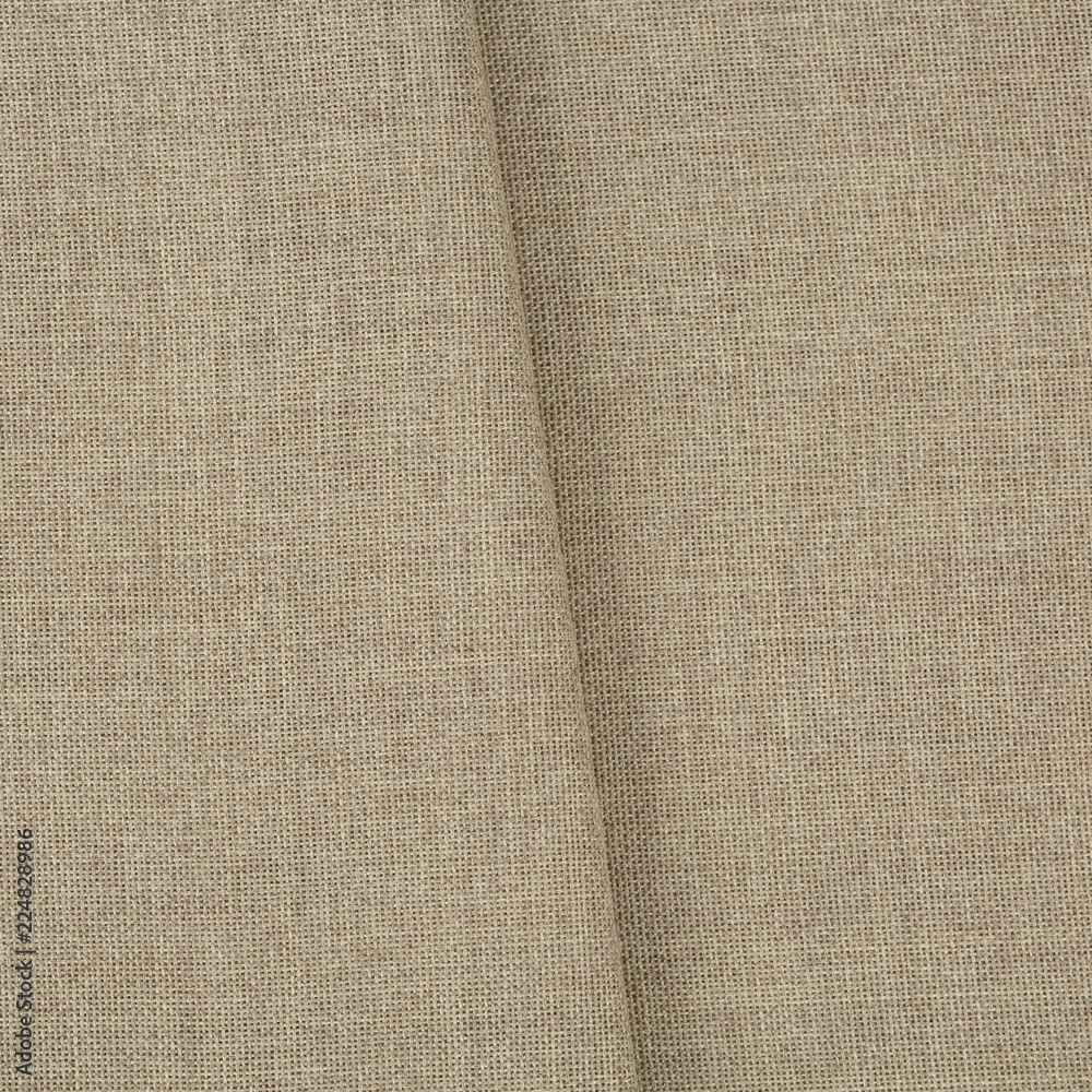 Texture canvas fabric as background. Texture fabric for feminine and men's shirts from flax.