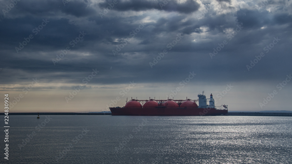 LNG TANKER - Rain and stormy dramatic clouds over a gas terminal in Swinoujscie
