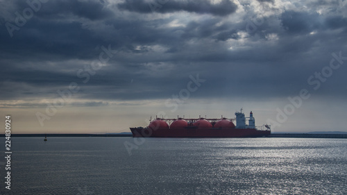 LNG TANKER - Rain and stormy dramatic clouds over a gas terminal in Swinoujscie
